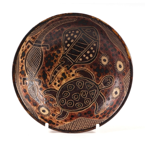 59 - Carl Cooper (Australian 1912-1966) - a small Studio pottery dish decorated with a turtle, lizard and... 