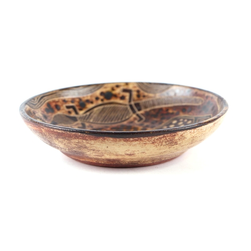 59 - Carl Cooper (Australian 1912-1966) - a small Studio pottery dish decorated with a turtle, lizard and... 