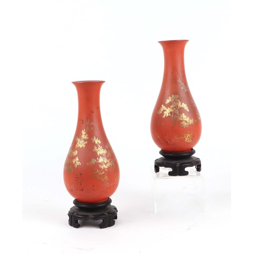 616 - A pair of Chinese Foo Chow style Tai Kut lacquer vases decorated a gilded landscape scene on a red g... 