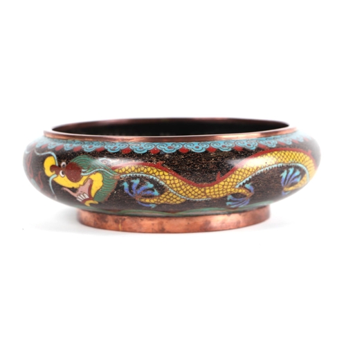 619 - A Chinese cloisonné enamel bowl decorated with a dragon, four character mark to base, 20cms diameter... 