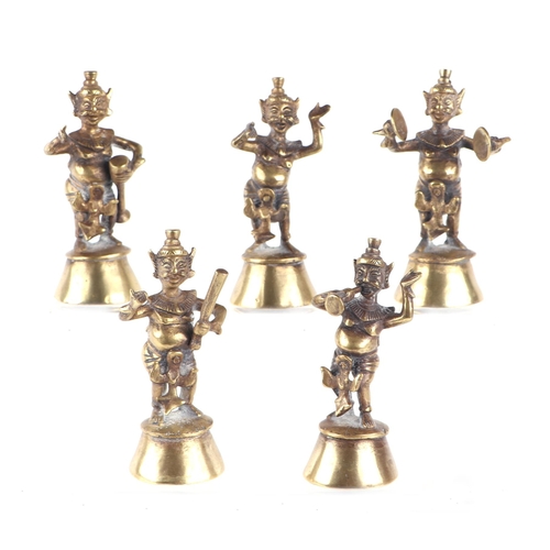 624 - A set of five Nepalese / Indian cast brass temple figures playing various musical instruments, each ... 