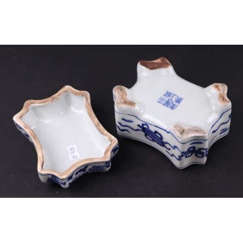 626 - A Chinese blue & white shaped rectangular box and cover, the cover decorated with a phoenix, blue ch... 