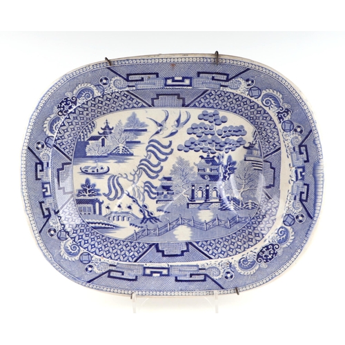 63 - A group of seven blue and white meat plates, largest 51cm wide together with two shaped side dishes,... 