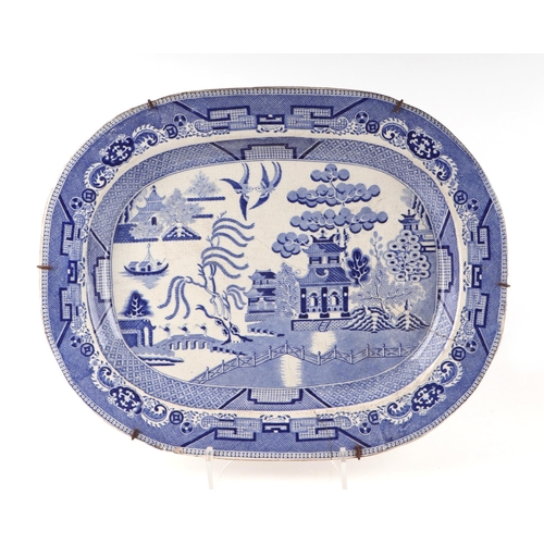 63 - A group of seven blue and white meat plates, largest 51cm wide together with two shaped side dishes,... 