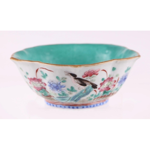 633 - A Chinese Qing dynasty famille rose lotus flower bowl decorated with birds and flowers, red seal mar... 