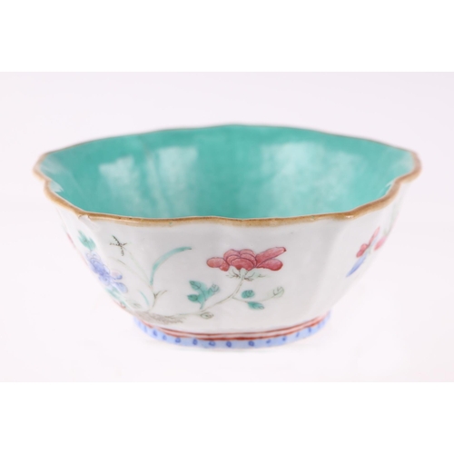 633 - A Chinese Qing dynasty famille rose lotus flower bowl decorated with birds and flowers, red seal mar... 