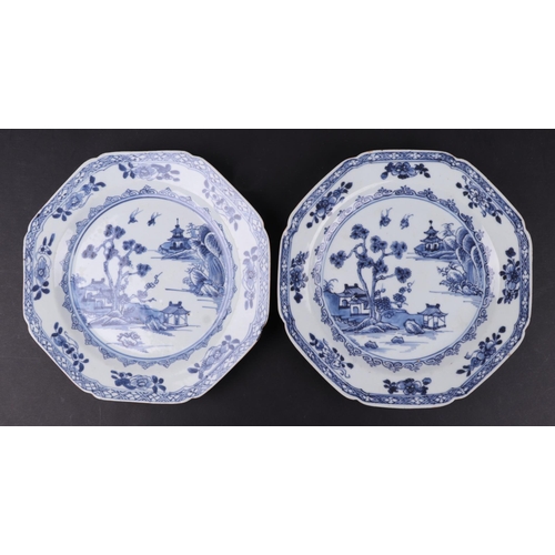 635 - A pair of 19th century Chinese blue & white plates of octagonal form decorated with a river landscap... 