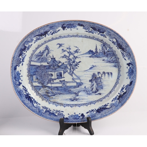 639 - A large 18th century Chinese blue & white oval meat plate decorated with a river landscape scene, 39... 