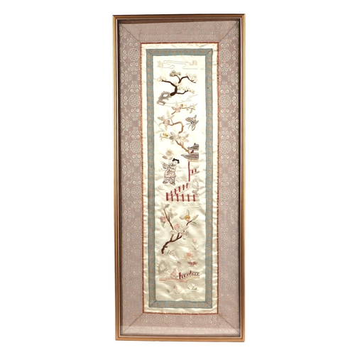 648 - A Chinese silk embroidered panel depicting figures in a landscape, framed & glazed, 16 by 55cms.