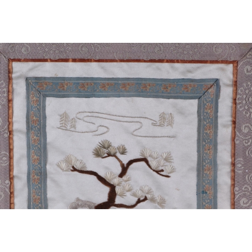 648 - A Chinese silk embroidered panel depicting figures in a landscape, framed & glazed, 16 by 55cms.