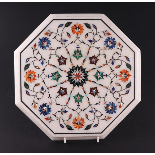 650 - An Indian inlaid alabaster pietra dura style octagonal occasional table top, 30cms diameter.