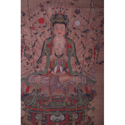 658 - A Chinese watercolour scroll painting depicting a deity seated in the lotus position, 113 by 56cms.