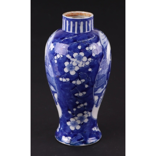 663 - A Chinese blue & white baluster vase decorated with figures within panels, on a cracked ice prunus g... 