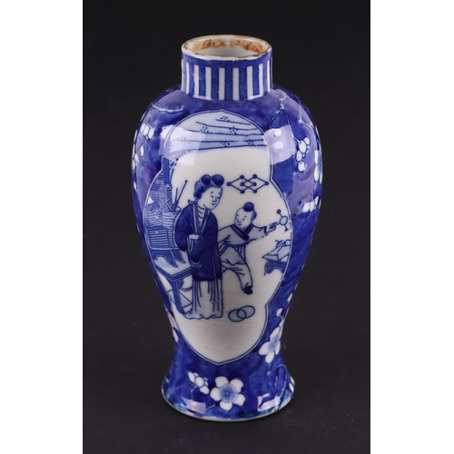 663 - A Chinese blue & white baluster vase decorated with figures within panels, on a cracked ice prunus g... 