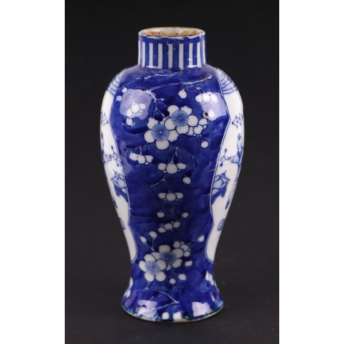 663 - A Chinese blue & white baluster vase decorated with figures within panels, on a cracked ice prunus g... 