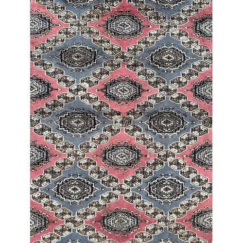 735 - A Caucasian rug, having a multi floral and geometric design on a blue ground, 278cm by 183cm.