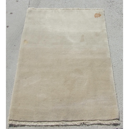 740 - A  beige Persian Gabbeh rug, 150 by 100cms.