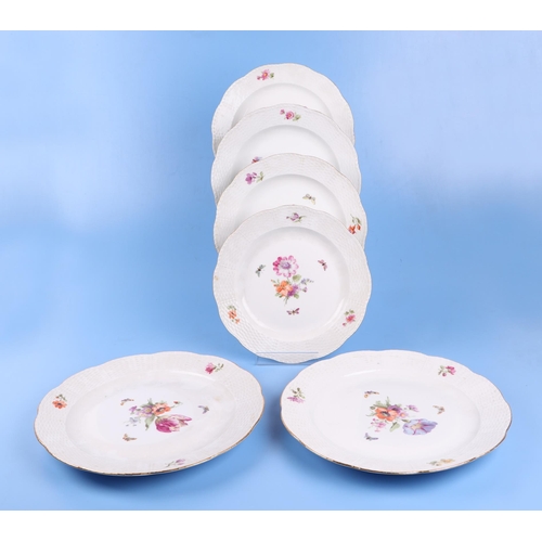 767 - A quantity of KPM Berlin porcelain decorated with flowers and butterflies to include dinner plates a... 