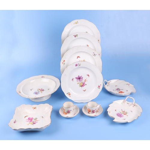 767 - A quantity of KPM Berlin porcelain decorated with flowers and butterflies to include dinner plates a... 