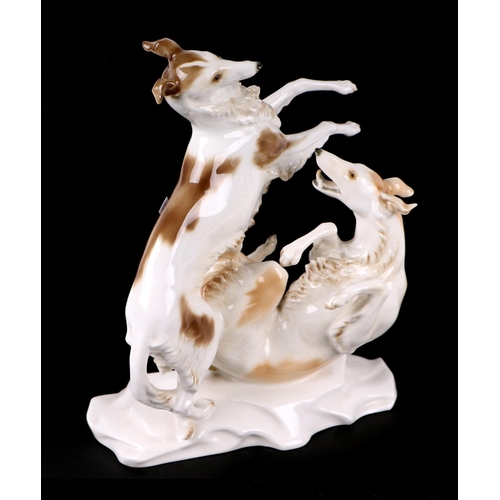 770 - A 1930's Hutschenreuther LHS Borzoi dog group, signed 'MHF', 29cms high.