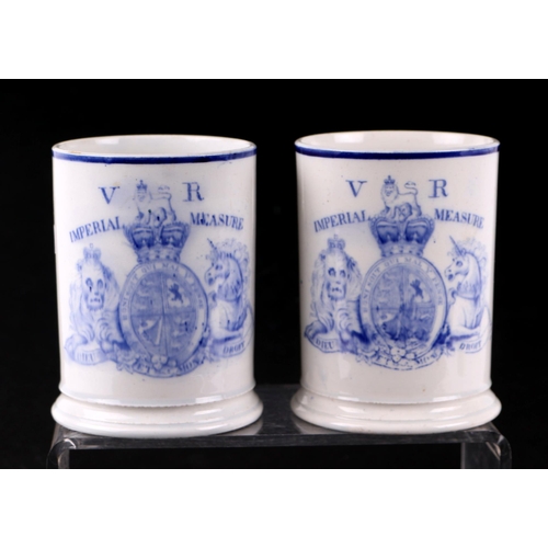 776 - A pair of early Victorian Davenport port tankards with large 'VR' Imperial Measure crest to the fron... 