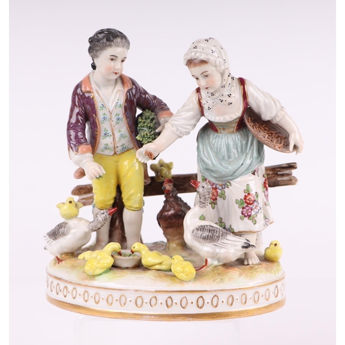 779 - A 19th century Volkstedt Dresden porcelain group depicting a courting couple feeding geese and chick... 