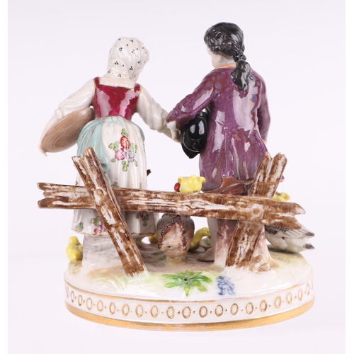 779 - A 19th century Volkstedt Dresden porcelain group depicting a courting couple feeding geese and chick... 