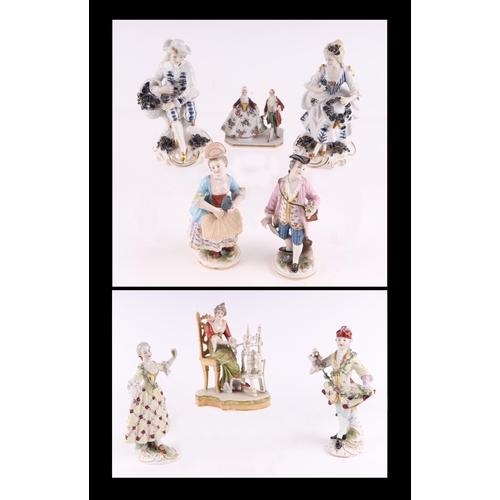 789 - A pair of Chelsea style porcelain figures depicting a gentleman in court dress with his companion, e... 