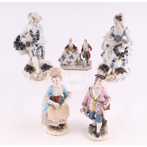 789 - A pair of Chelsea style porcelain figures depicting a gentleman in court dress with his companion, e... 