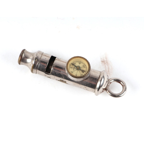 842 - A group of vintage whistles to include a military example dated 1945, another surmounted a compass, ... 