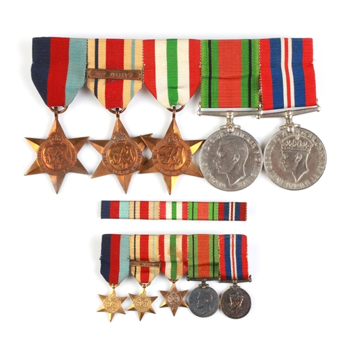 843 - A WWII medal group to include Defence Medal, War Medal, Italy, Africa and 1939-45 Star with matching... 