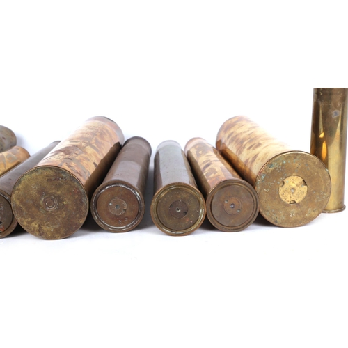 847 - A small collection of WWI brass shell cases, the largest 36cms high (11).