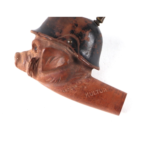 852 - A World War I French carved walnut and horn propaganda caricature smoking pipe, modelled as a pig we... 