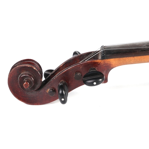 862 - A one-piece back violin in a wooden case, 54cms long.