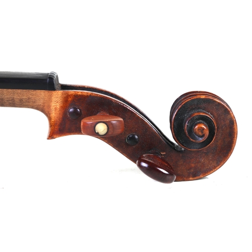 863 - A two-piece back Stradivarius copy violin, 59cms long, in a painted grained case.