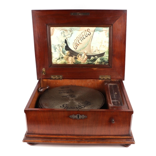 876 - A 19th century Morpheus Polyphon in a walnut case, 46cms wide; together with six discs each 29.5cms ... 