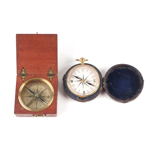 880 - A 19th century gilt brass pocket compass in a leather case, 5cms diameter; together with a mahogany ... 