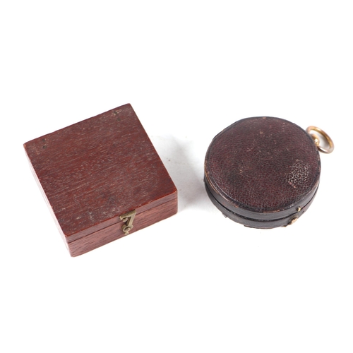 880 - A 19th century gilt brass pocket compass in a leather case, 5cms diameter; together with a mahogany ... 