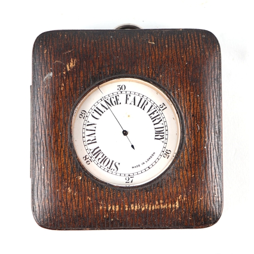 891 - A late 19th / early 20th century nickel cased pocket barometer, cased, 6.5cms diameter.