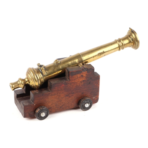 94 - 19th century French bronze signal cannon on a later wooden carriage and wheels. Overall barrel lengt... 