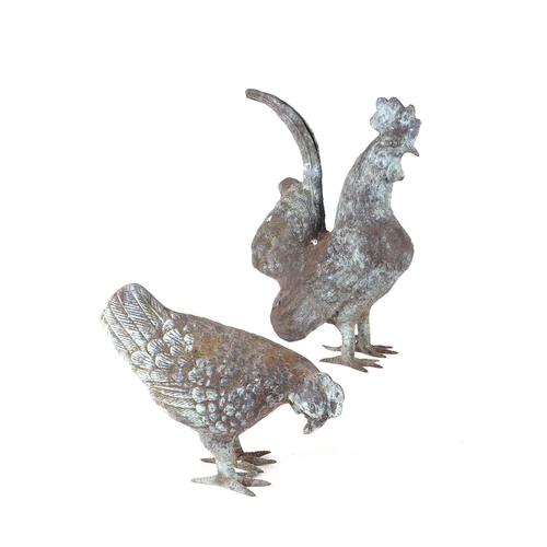 955 - A chicken and a cockerel patinated metal figures, the largest figure 28cms high (2).