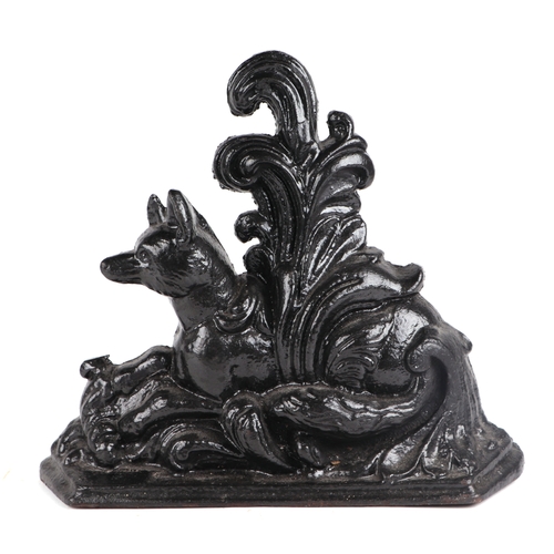 239 - A Regency cast iron door stop depicting a recumbent fox, 29cms high.