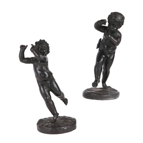 238 - A pair of Regency bronze Amorini on bases, 21cms high (2).