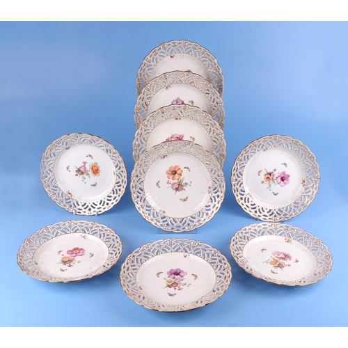 768 - Nine KPM Berlin ribbon plates decorated with flowers and butterflies, 23cms diameter (9).