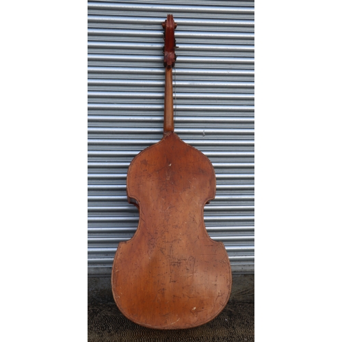 860 - A double bass with single piece back, ebony finger board and heavily carved scroll with brass plates... 