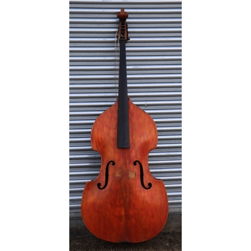 860 - A double bass with single piece back, ebony finger board and heavily carved scroll with brass plates... 