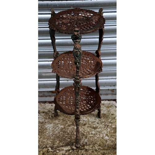 6 - A Victorian style cast iron three-tier pan stand, 65cms high.