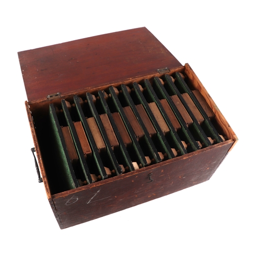 151 - A late 19th / early 20th century travelling bingo callers set with twelve number boards and counters... 