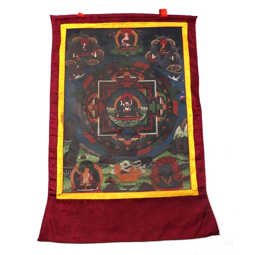 661A - A Sino-Tibetan thangka mandala decorated with multiple figures and deities. 51 by 72cm