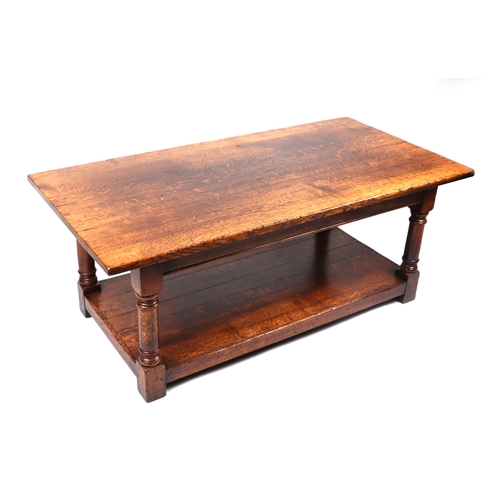 2010 - A George III style oak coffee table, 122cm wide